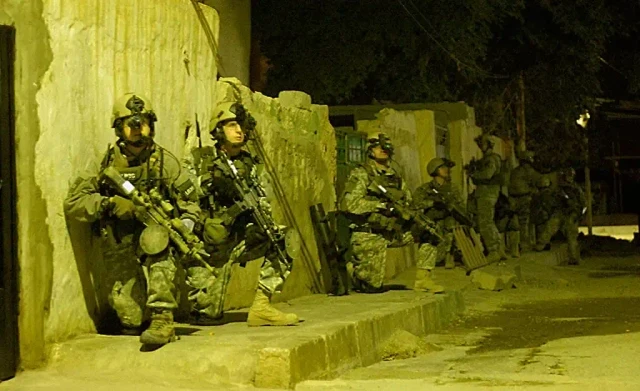 Rangers moving to the objective on a raid