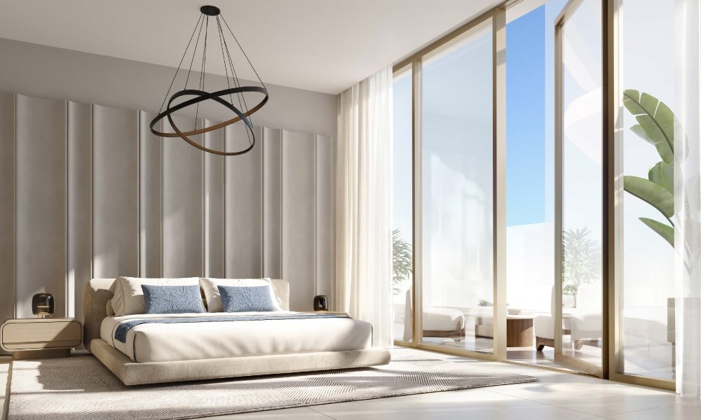 Stylish bedroom showcasing marble walls and flooring, part of Flora Shore Beachfront Residences.