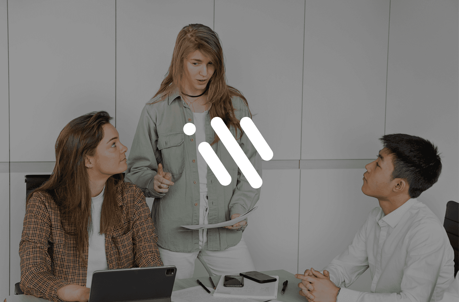 Team meeting discussion with Workvivo logo overlay.