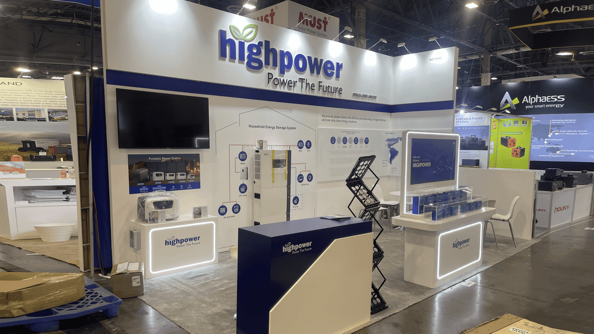 High Power RE+ 2023 10x20 clean energy booth in Las Vegas with close-up battery product counter, storage system graphics, and aisle-facing display
