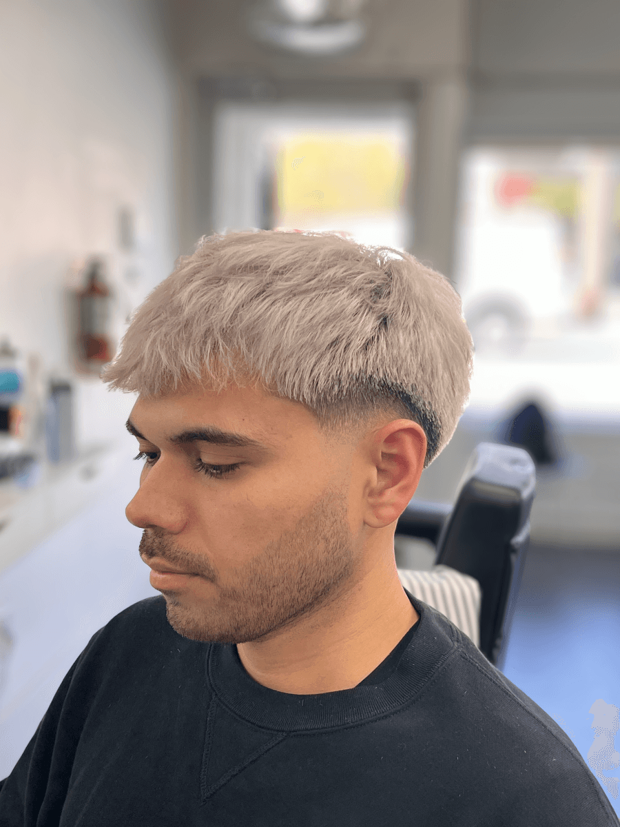 person holding gray hair curler