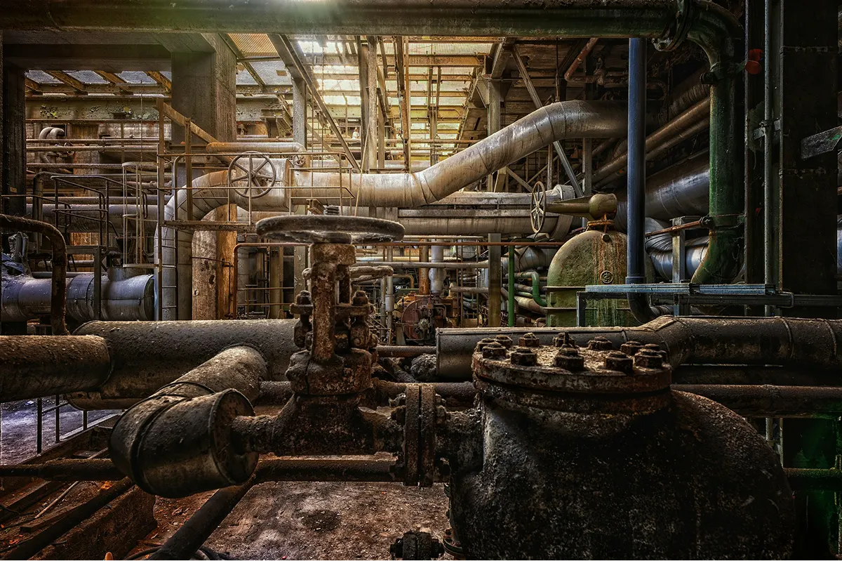 a large industrial building with pipes and pipes