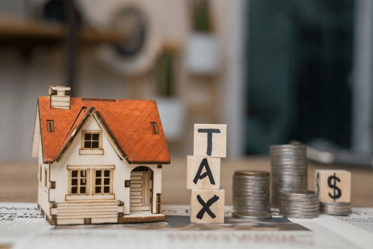 Foto de uma casa com a palavra taxa ao lado