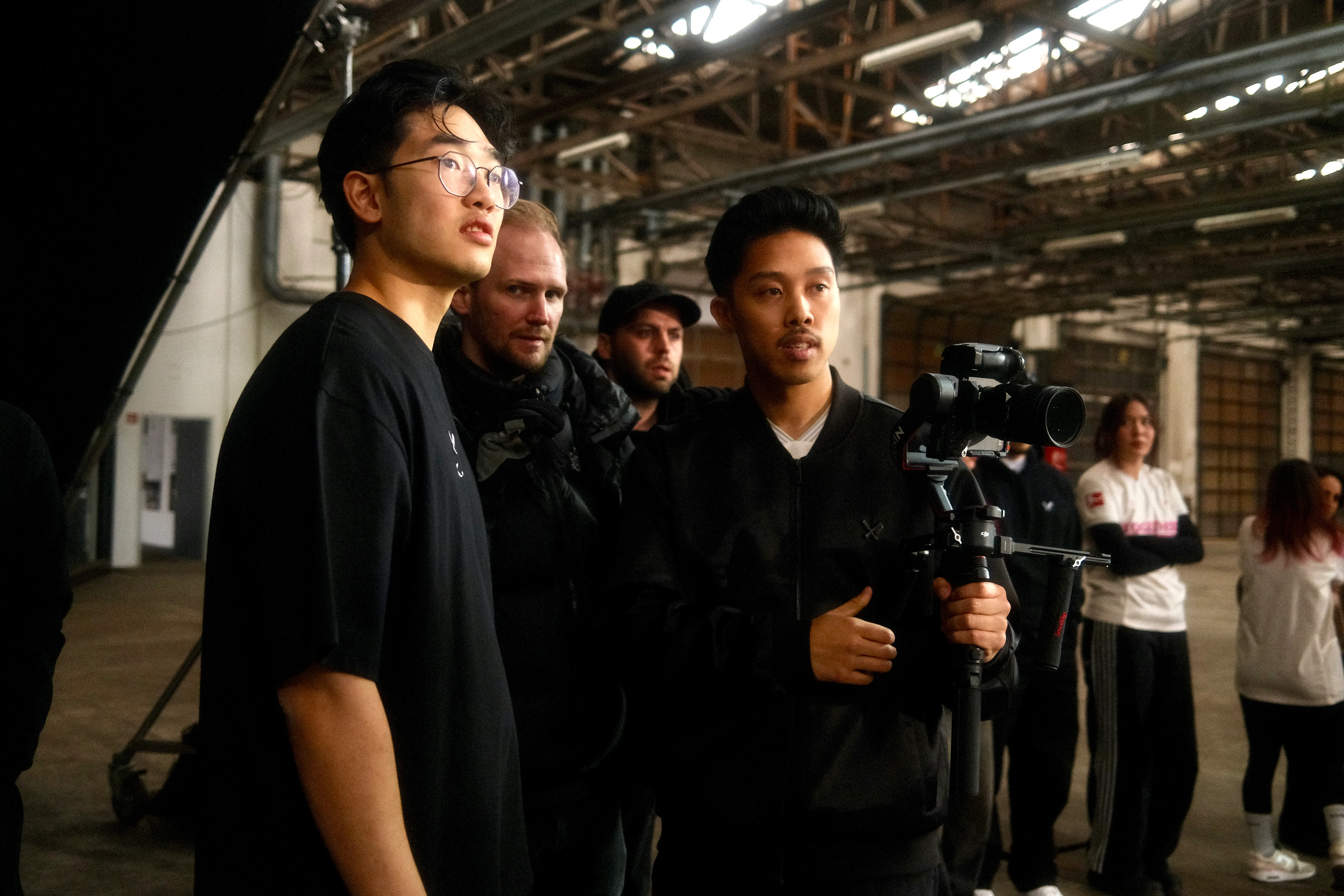 Woman in a beige turtleneck by an old computer and TV, retro 80s office portrait.