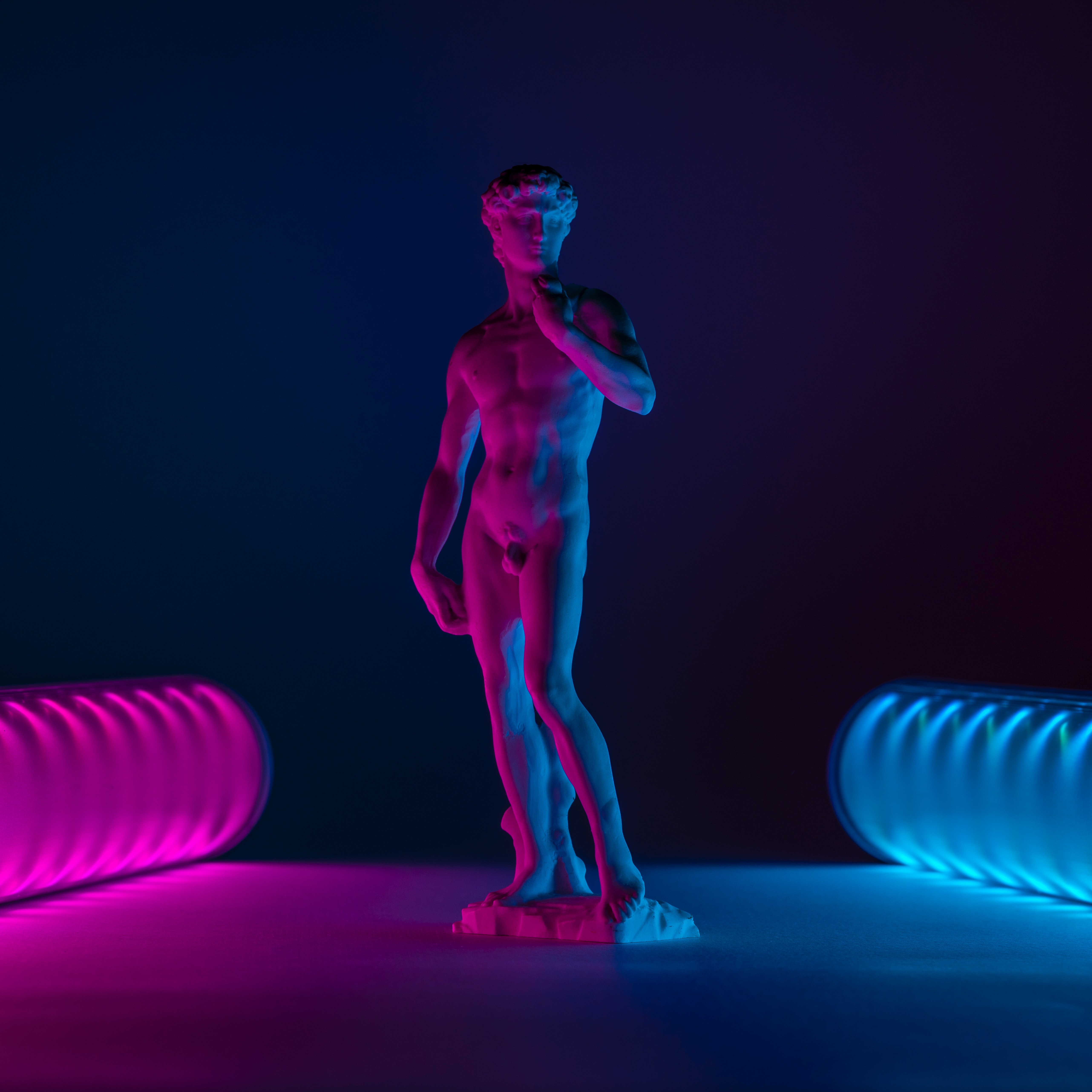 Abstract flower with glowing orange and white petals against a vivid blue background, creating a dreamy and ethereal aesthetic.