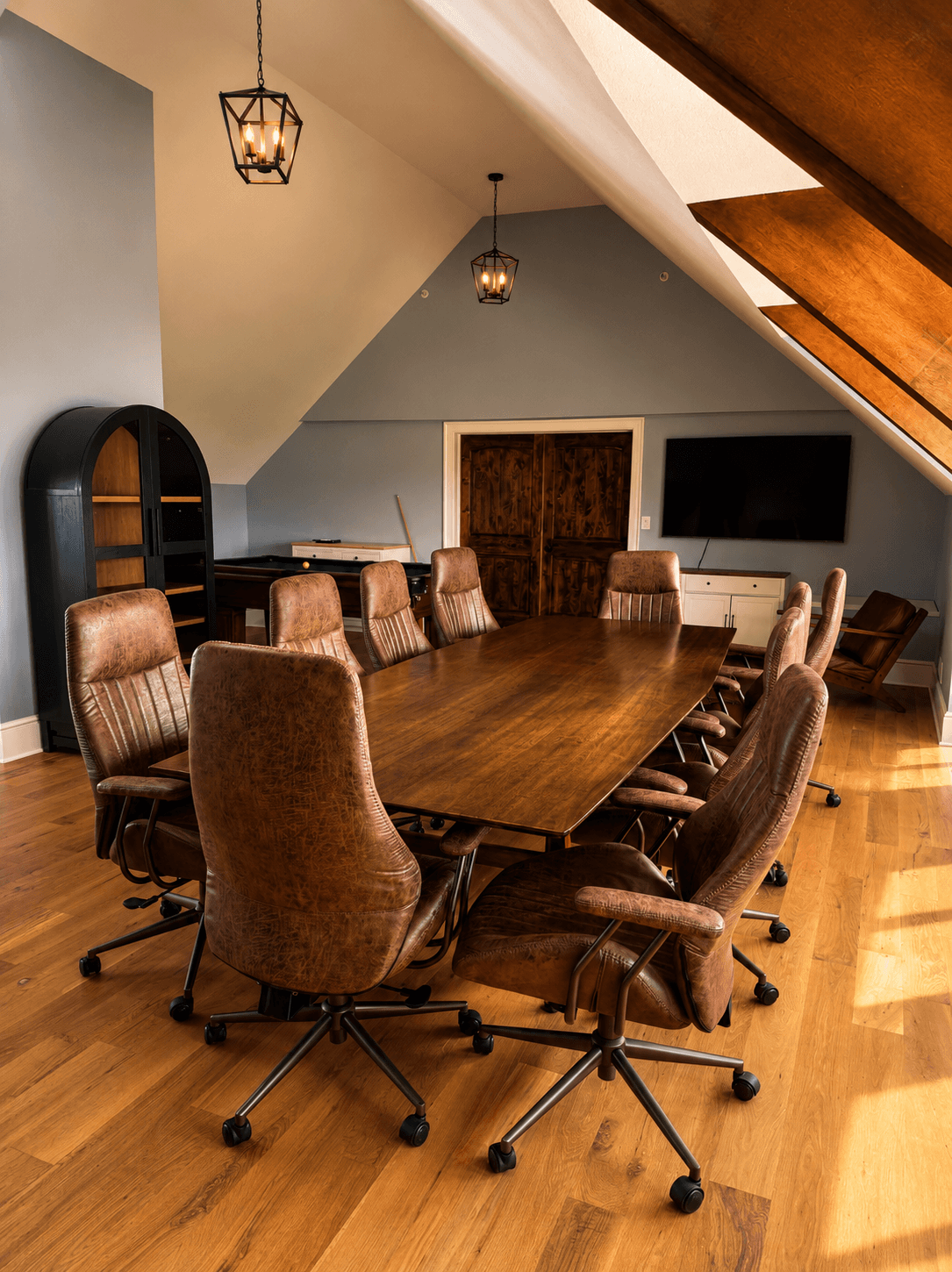The Loft's twelve-seat conference table under the dormer windows