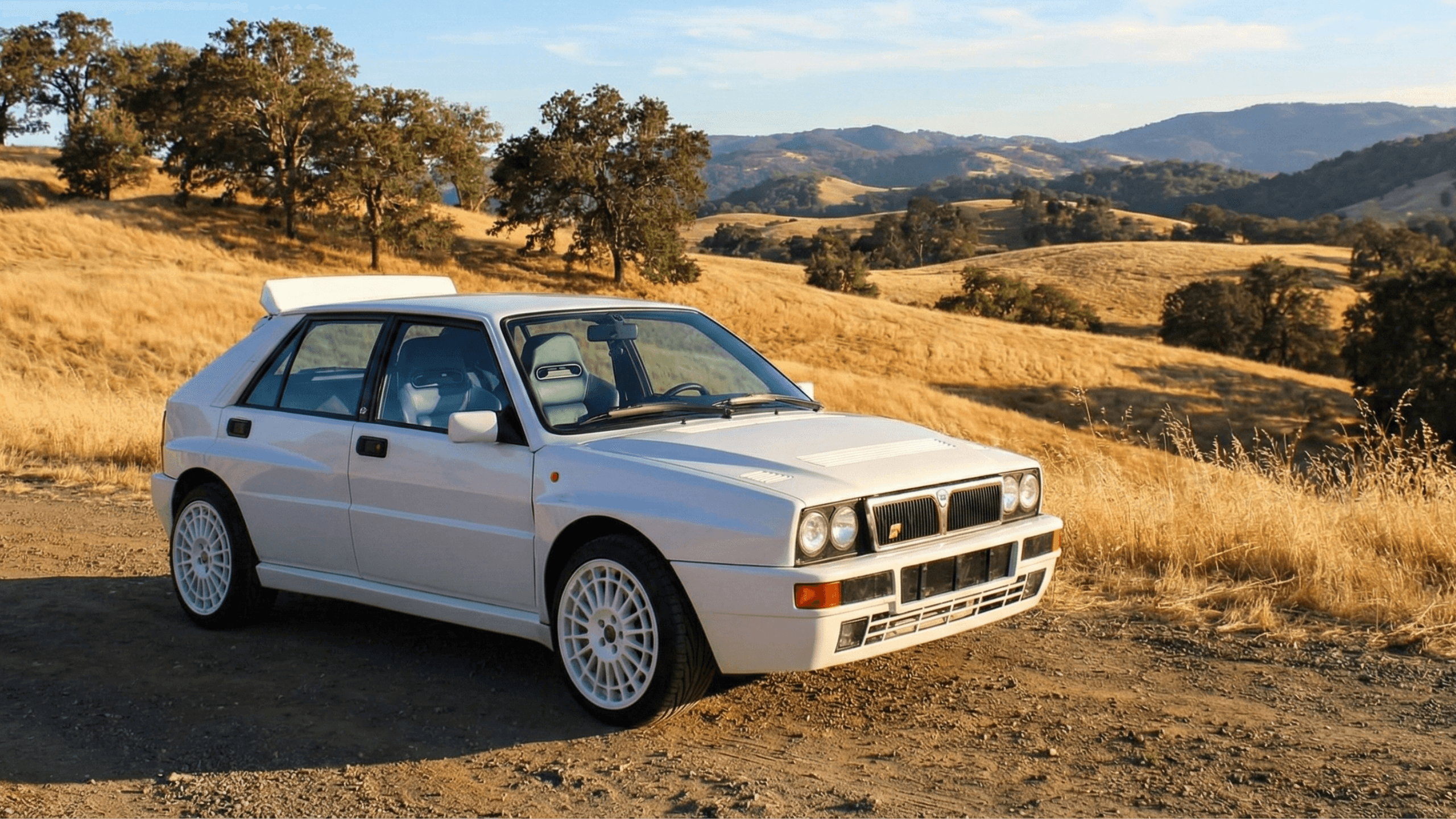 Lancia Delta Integrale rally car on gravel – evolution history of the iconic Group A rally legend