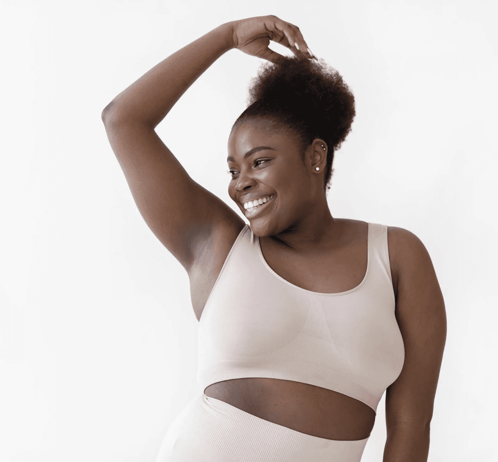 woman in white tank top with black butterfly tattoo on her left arm