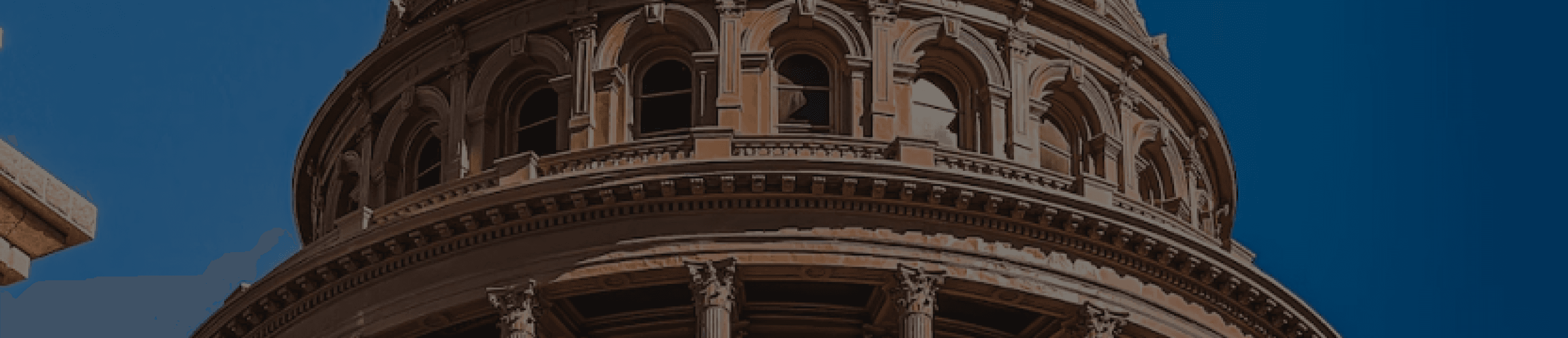 image of a state house building against a blue sky