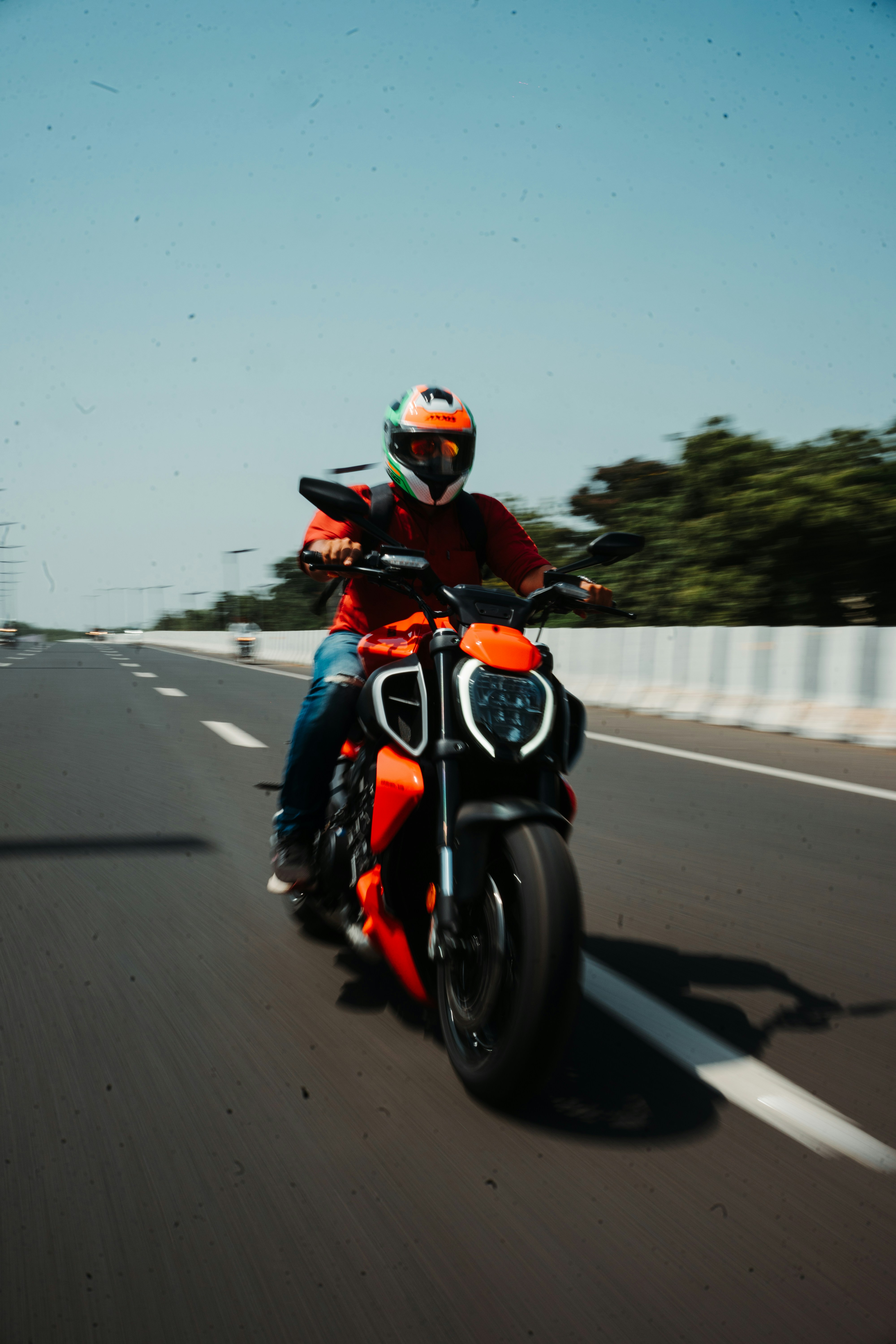 a person riding a motorcycle on a highway