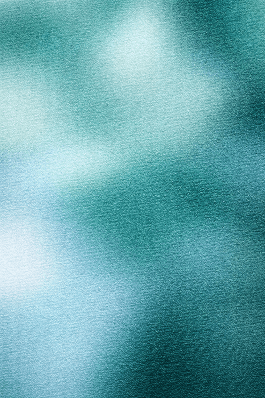 woman holding a phone and man looking at the phone. both are smiling