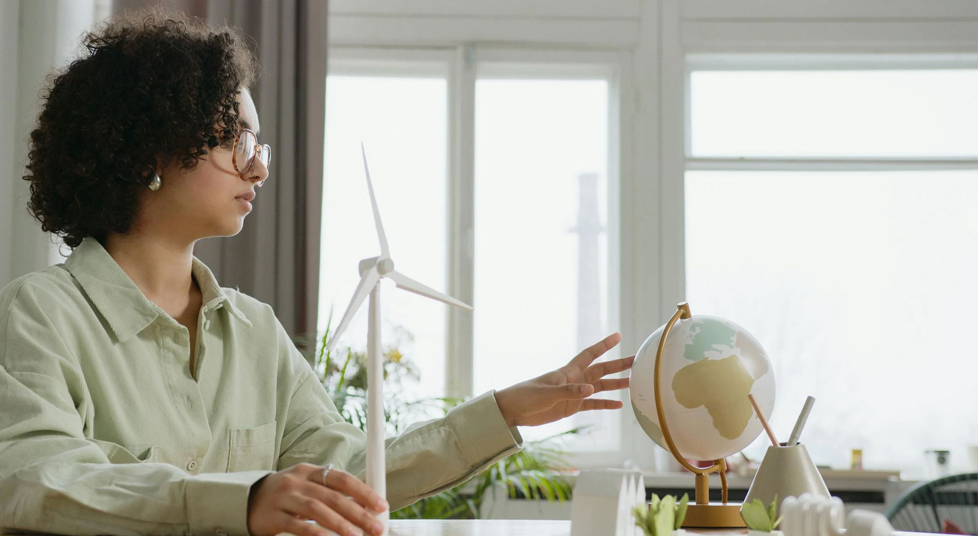 Women absorbing globe map