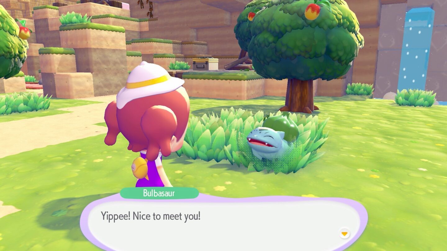 Interaction avec Bulbasaur dans Pokémon Pokopia dans un monde ouvert coloré où les joueurs rencontrent et vivent avec différents Pokémon