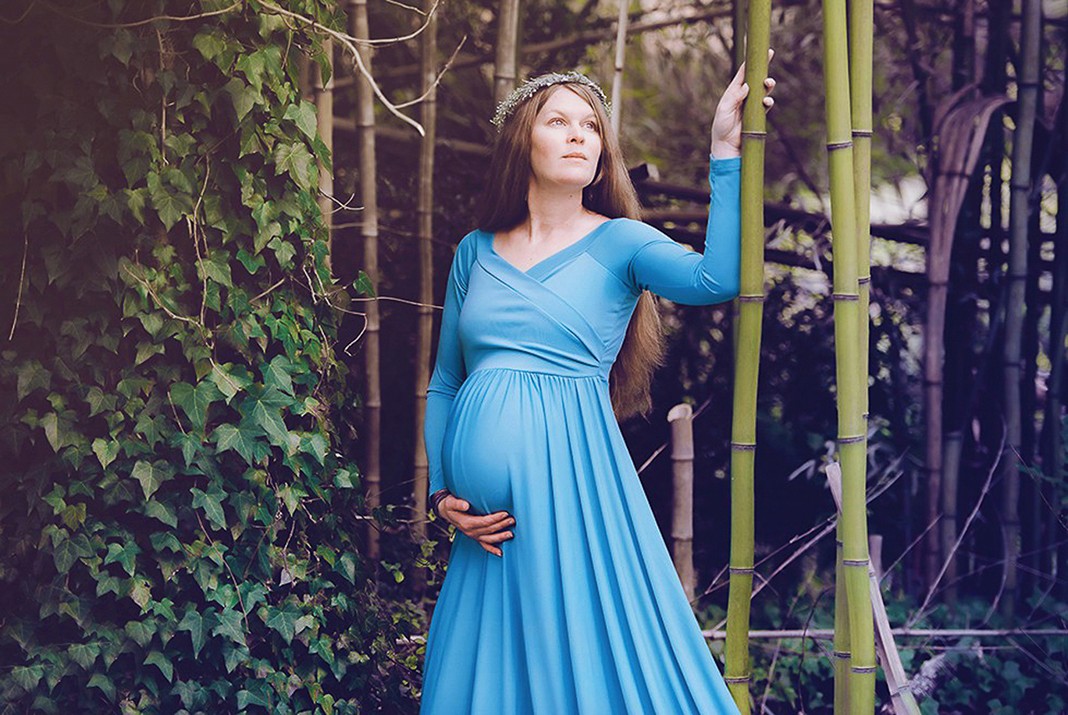 boy leaning against truck for graduation photos