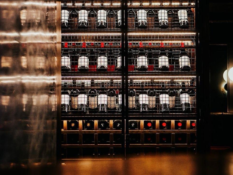 Commercial wine display behind a hospitality bar