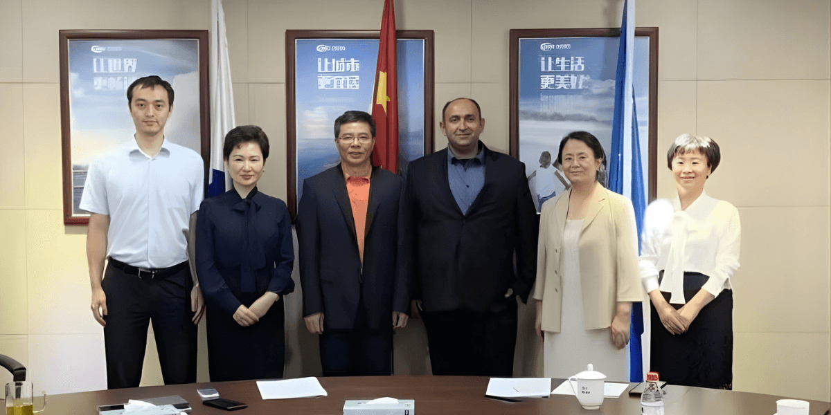 Hussein Faraj and colleagues at a meeting, discussing digital infrastructure and long-term sustainability.