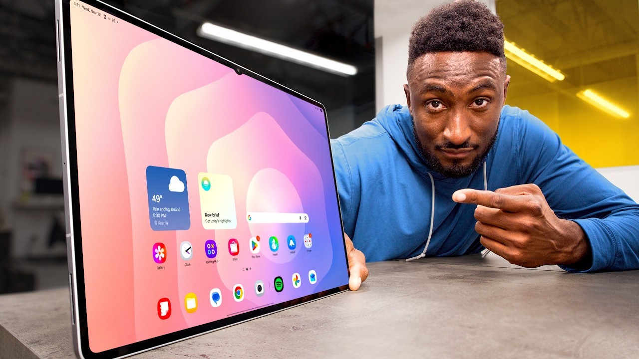 MKBHD-style tech roundup thumbnail with upright tablet home screen and pointing creator