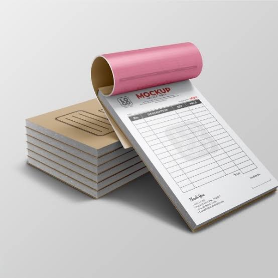 Invoice style paper sheets with stationery on a blue surface