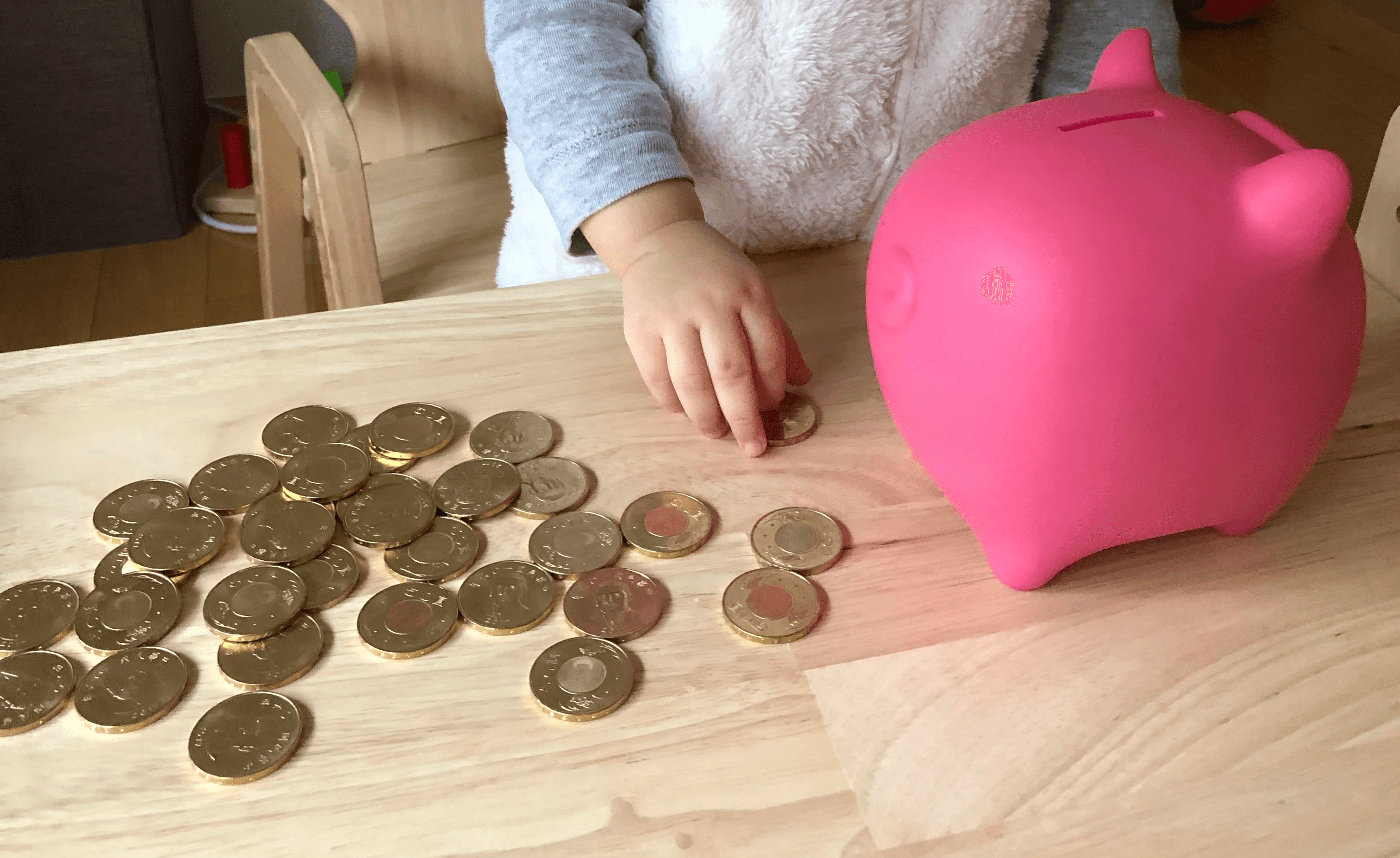 Close-up of lush, dark green leaves, some glossy and wet, against a muted background.