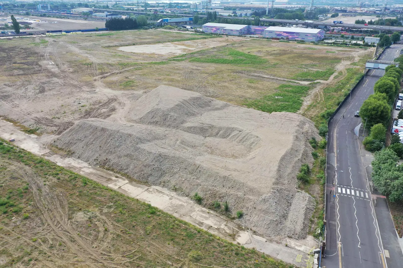 Drone volumetric survey of large soil stockpiles and earthworks on a development site for volume calculation