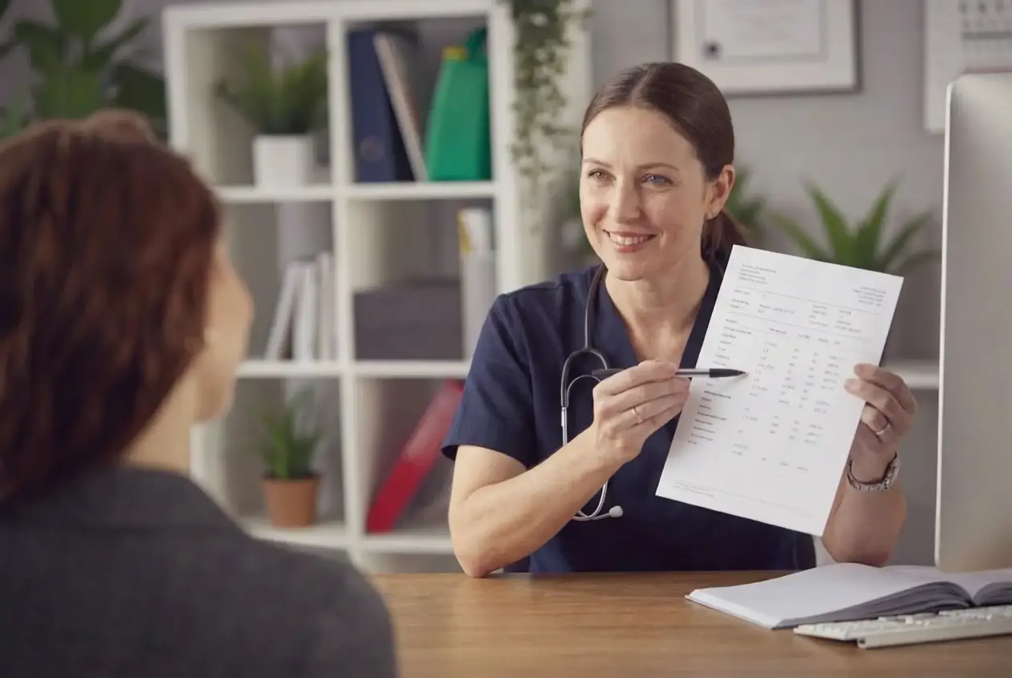 woman wearing gray long-sleeved shirt facing the sea