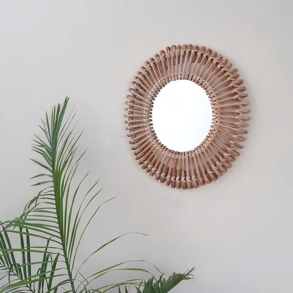 Handwoven round cane wall mirror for natural home décor