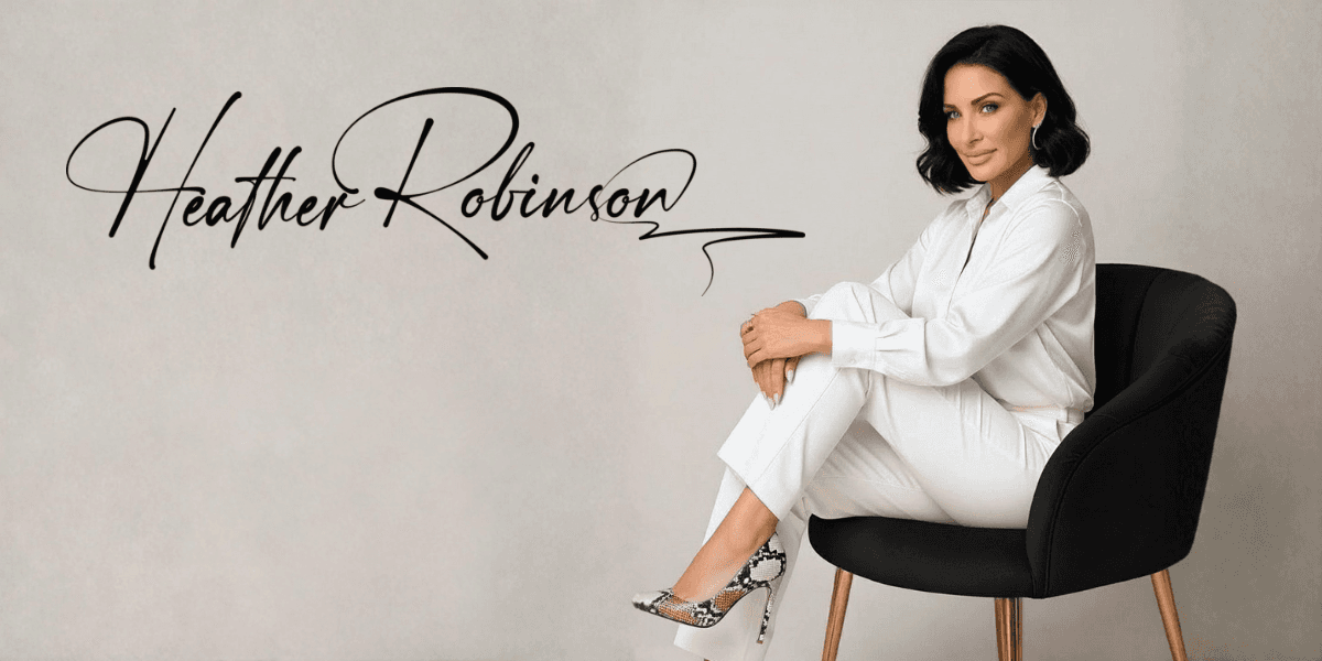 Woman in white suit sitting on black chair with “Heather Robinson” text, representing luxury commercial design brand.