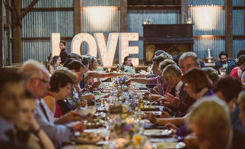 Guests enjoying their dinner at a wedding reception
