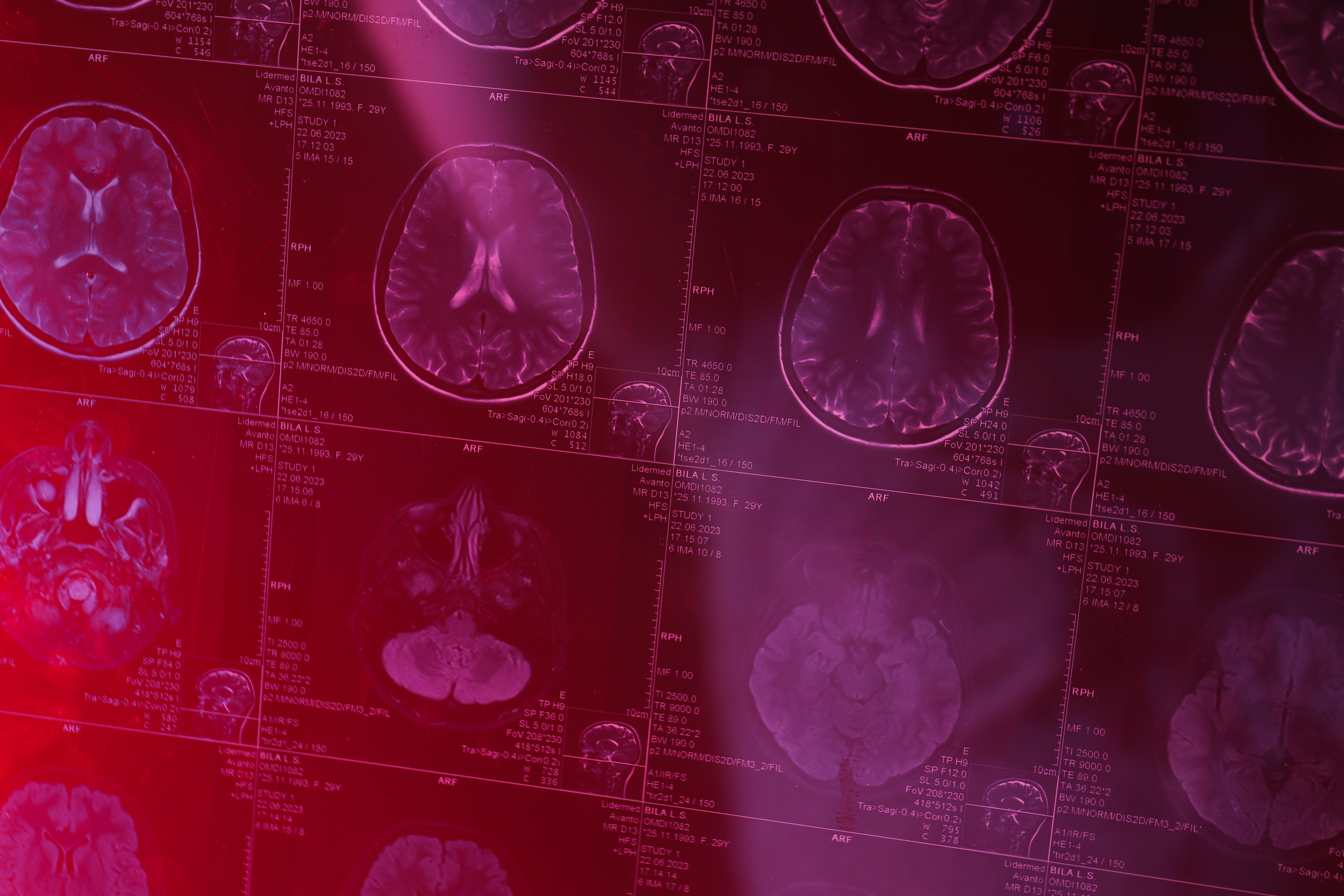 Confident female scientist standing with arms crossed in a cutting-edge laboratory filled with advanced scientific equipment.