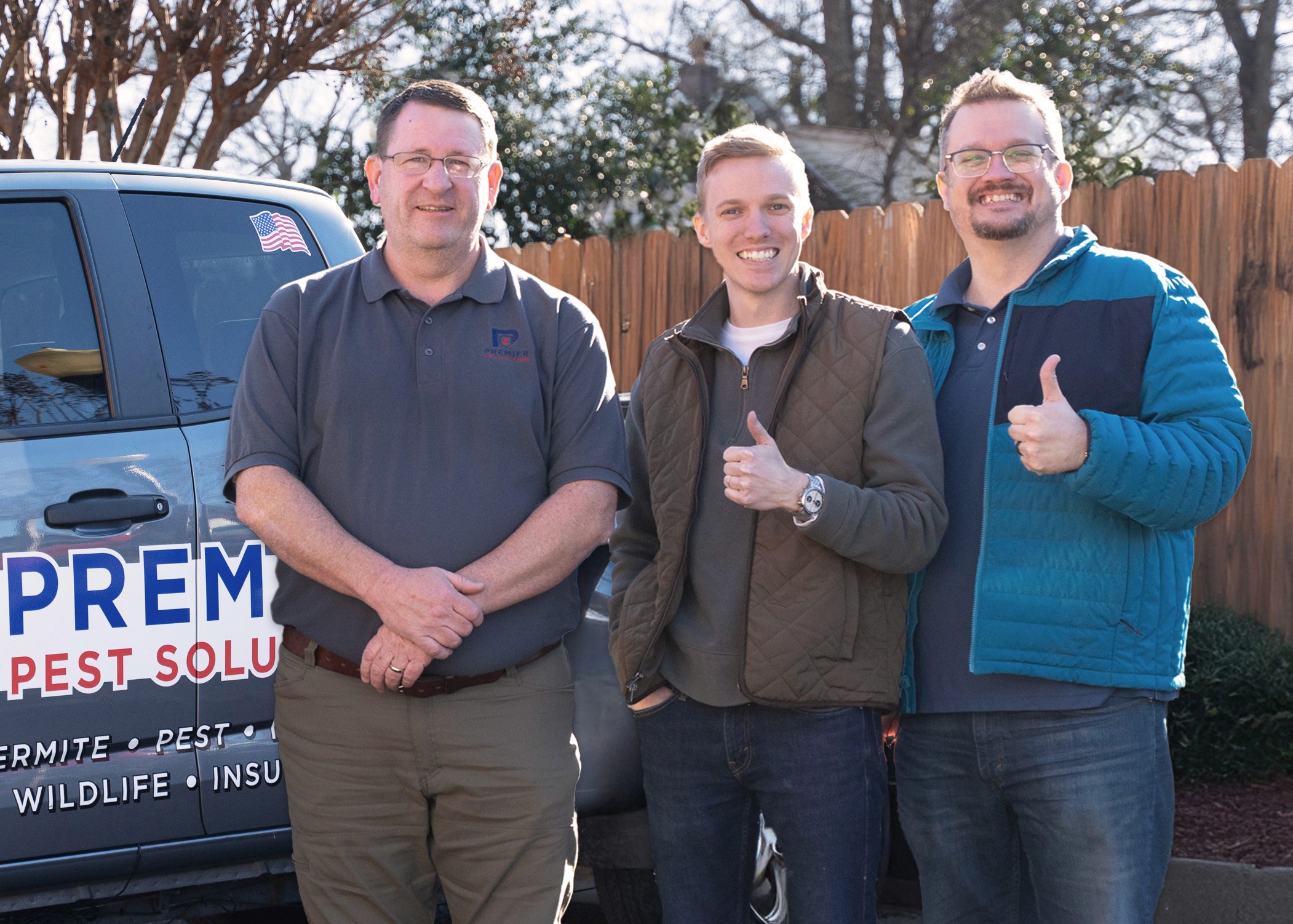Jason and Aaron (right) pose with a new client (left)