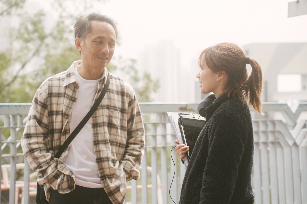 the actor playing the father is talking with the director