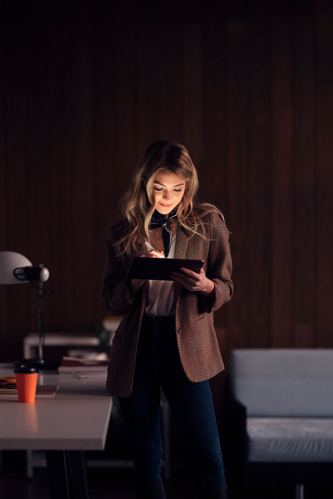 K1 visa lawyer reviewing documents on tablet in office