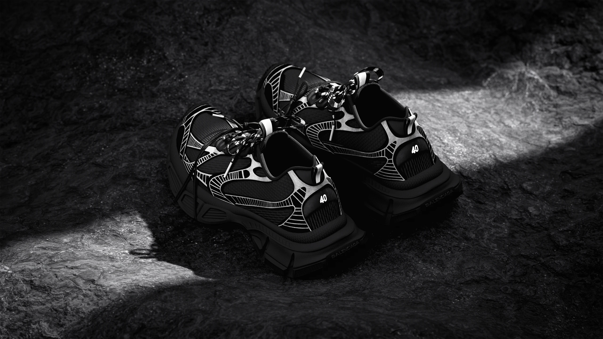 Balenciaga sneakers 3D render on dark rocks, black and white
