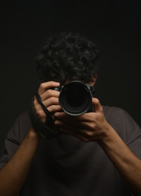 Photographer holding camera