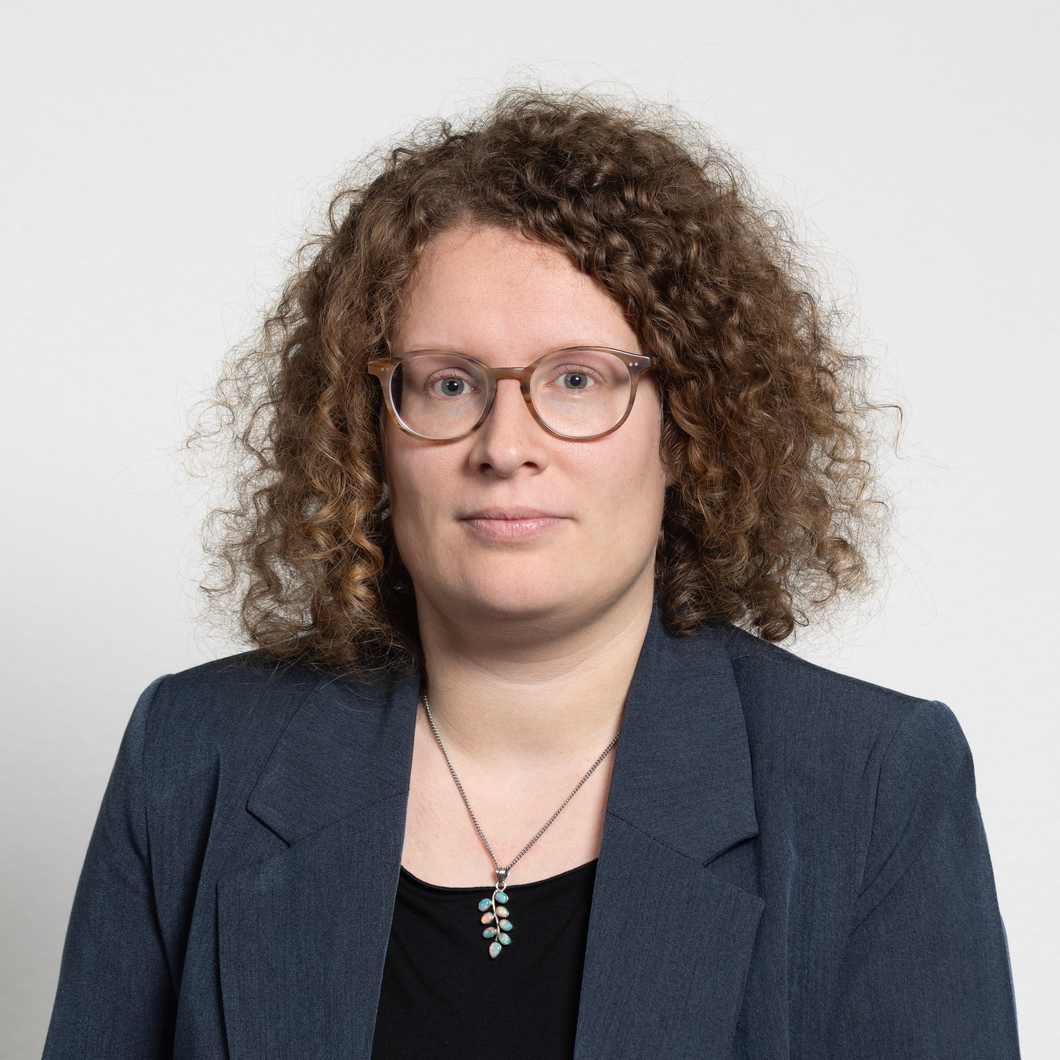 woman in white crew neck shirt smiling