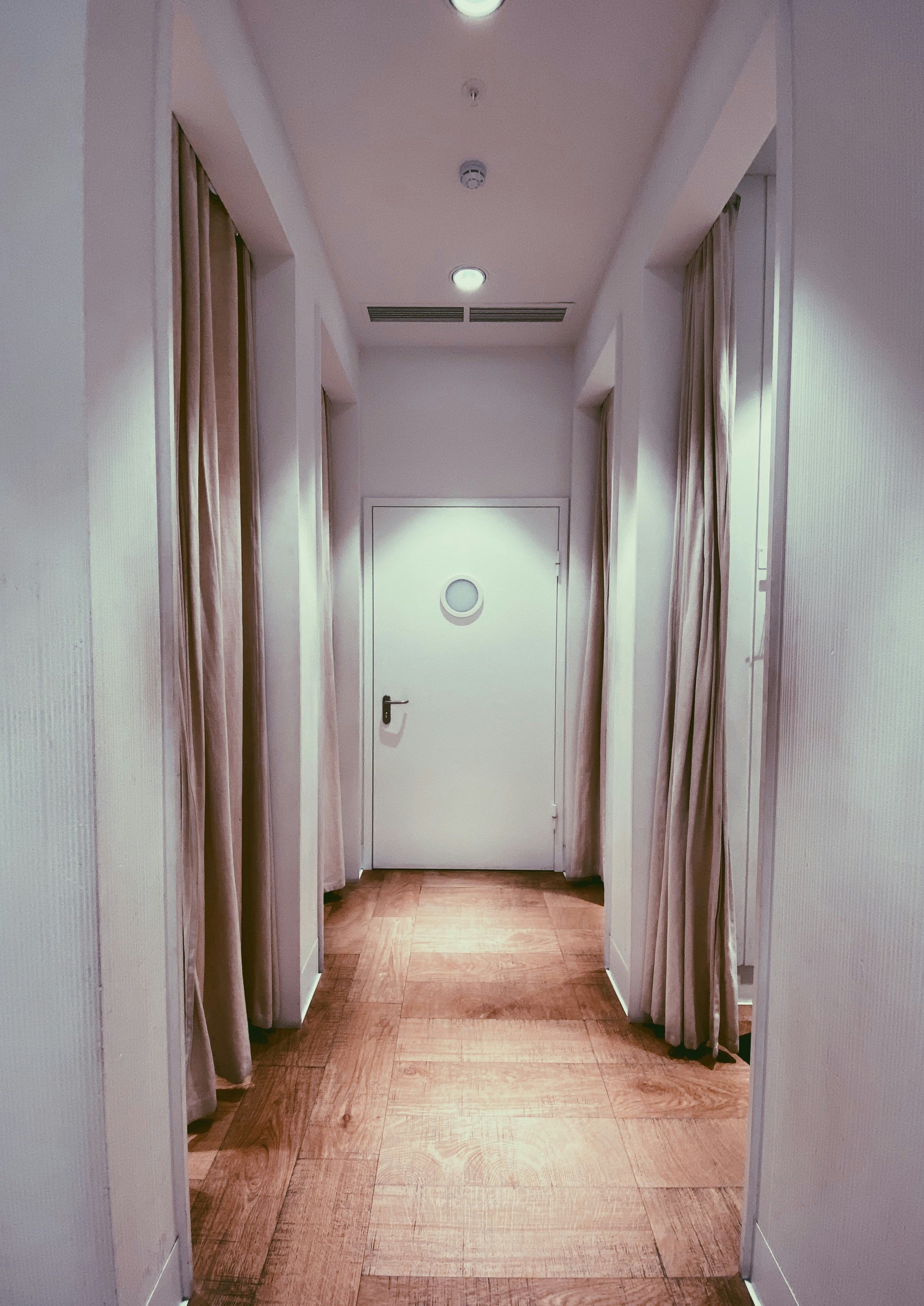 brown wooden parquet floor with white wall paint