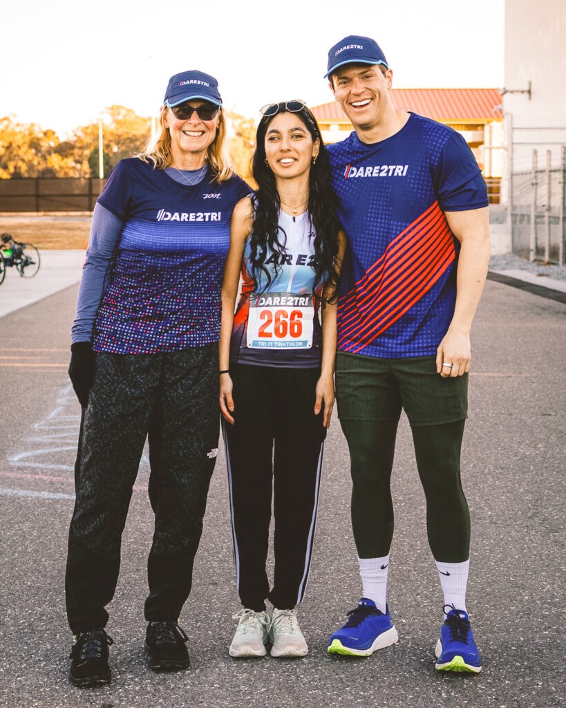 Adam Wolford (right) at a triathlon training camp with Christine Shaw Palmquist (left) and Manahil Jafri (center).