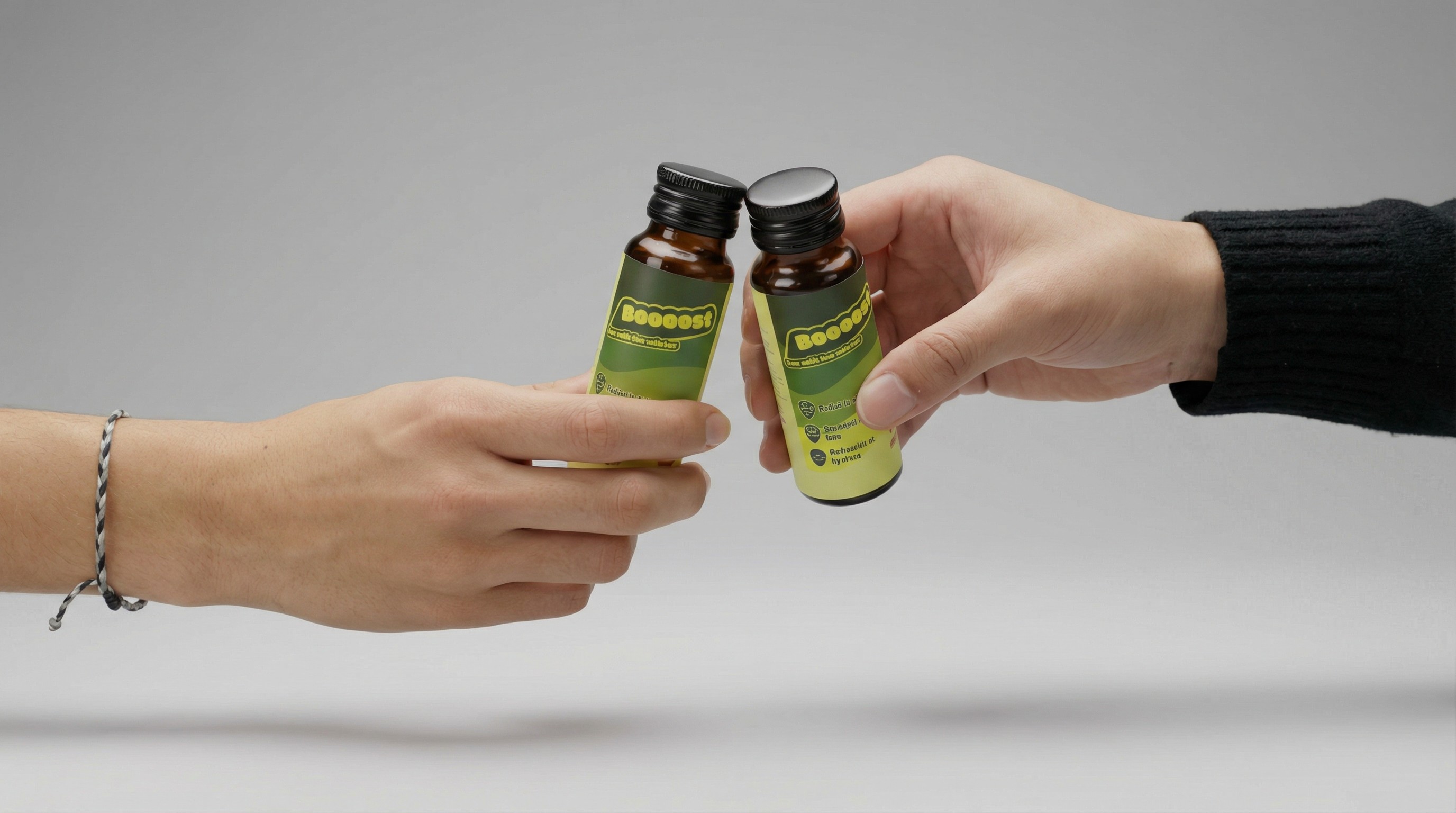 A smiling young man with crossed arms, wearing a plaid shirt and white t-shirt, poses against a dark background.