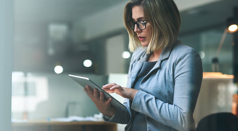 Young profressional woman holding a tablet