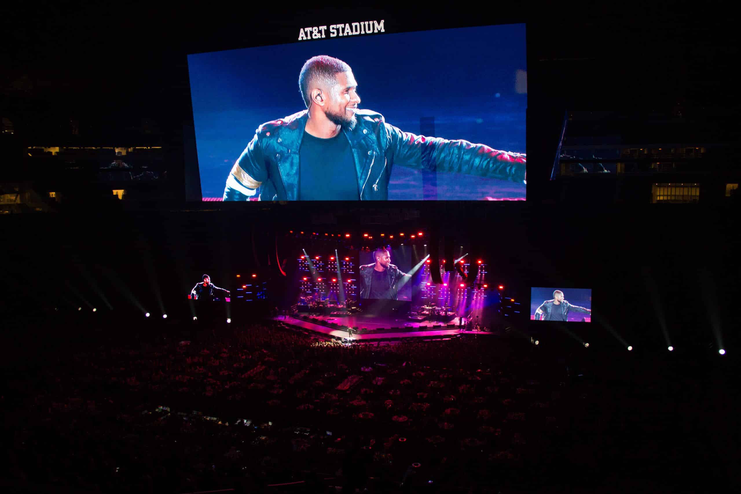 United Way of Metropolitan Dallas widew view of stage and giant LED screen showing USHER smiling