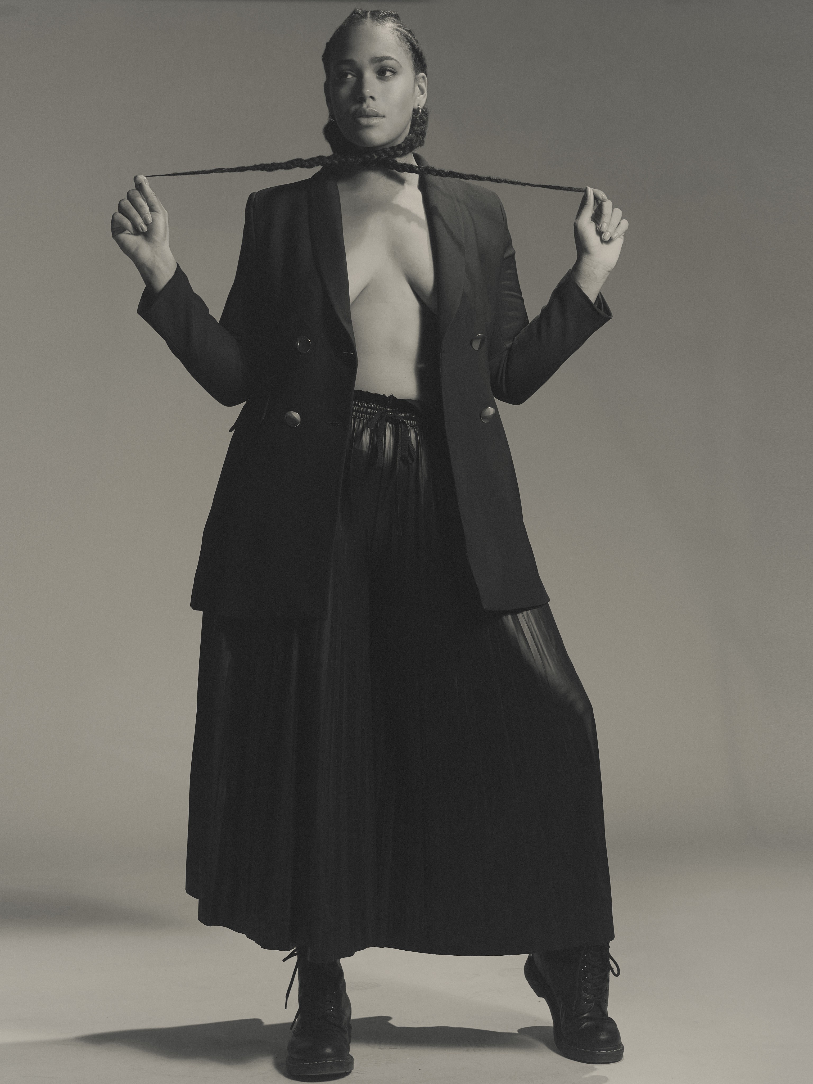 Shareefa J plus-size model in a black outfit posing for editorial shoot
