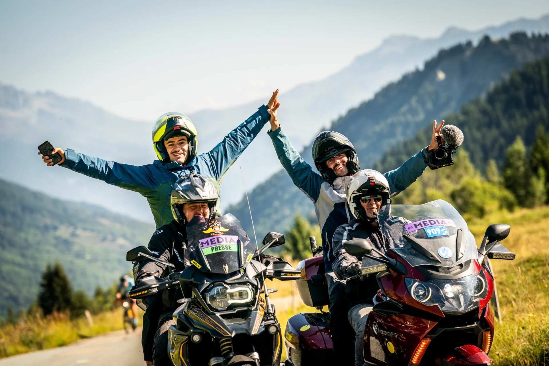 Media team on motorbikes filming the Haute Route Alps - mountain video capture