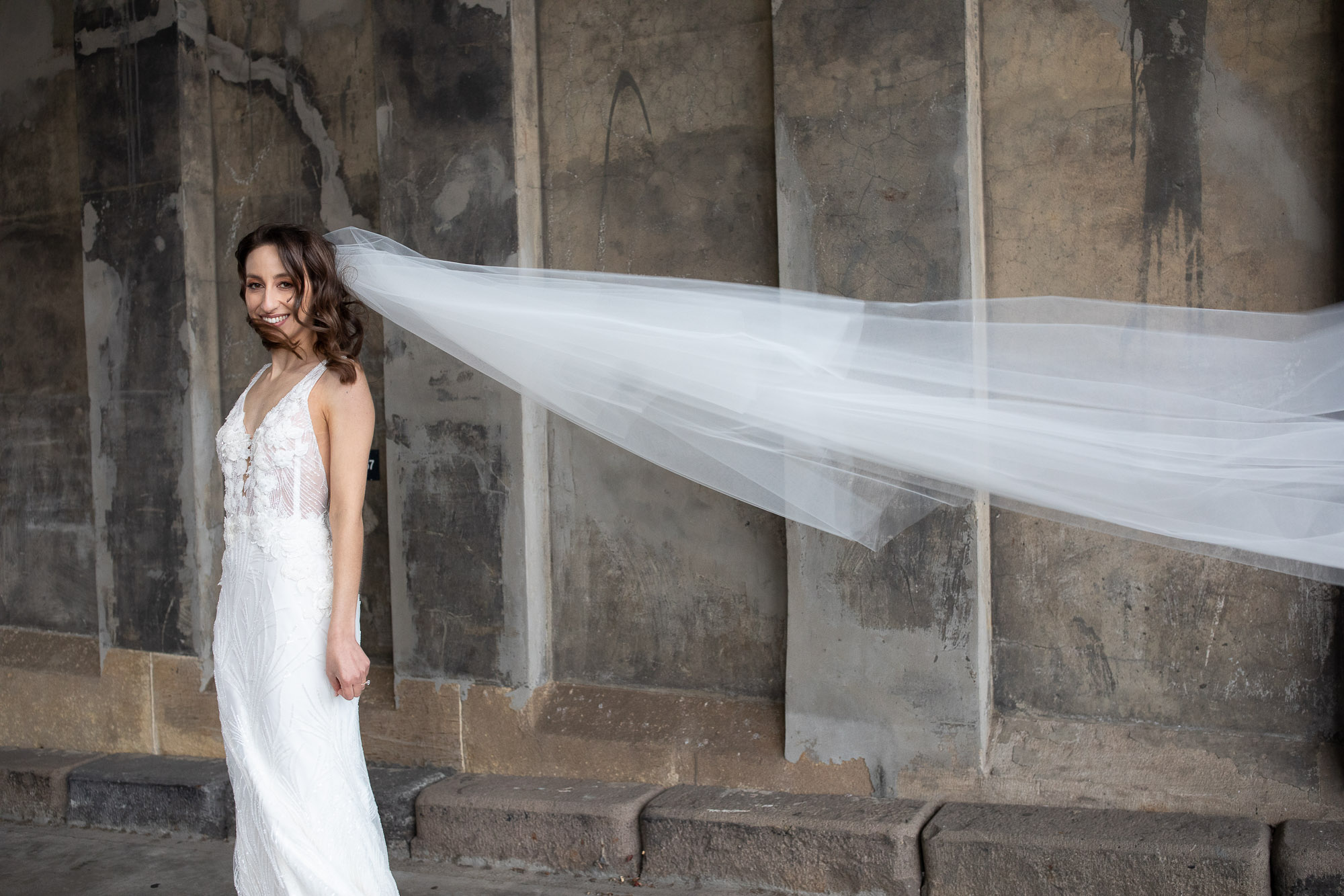 Elegant minimalist room with sheer curtains and two armchairs in soft natural light – wedding photographer studio