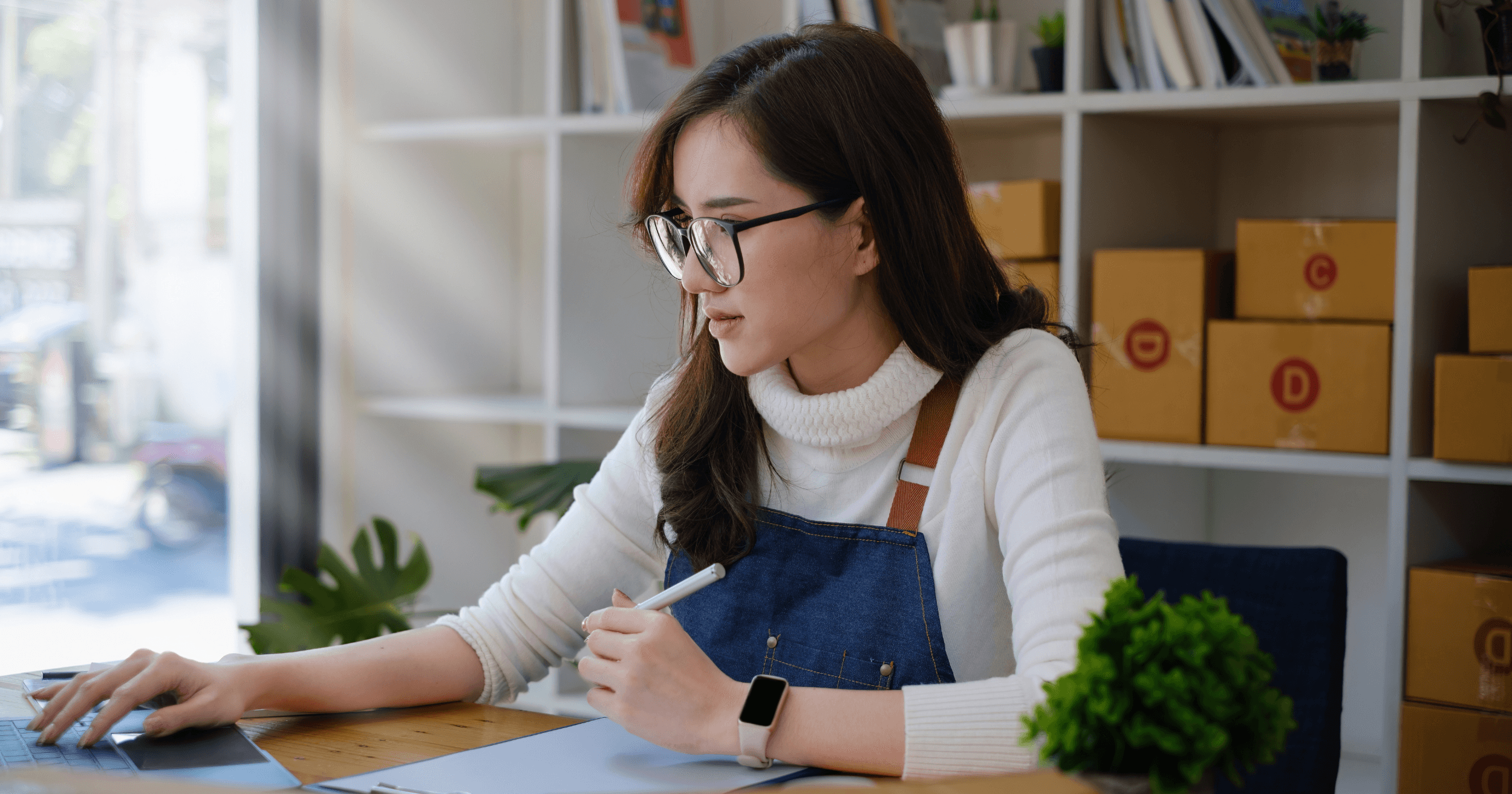 Small business owner researching about e-invoicing on a laptop