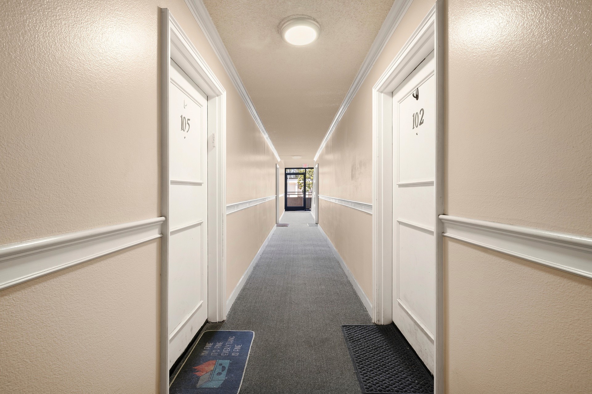 Interior hallway and unit entry corridor at 18620 burbank blvd apartments.