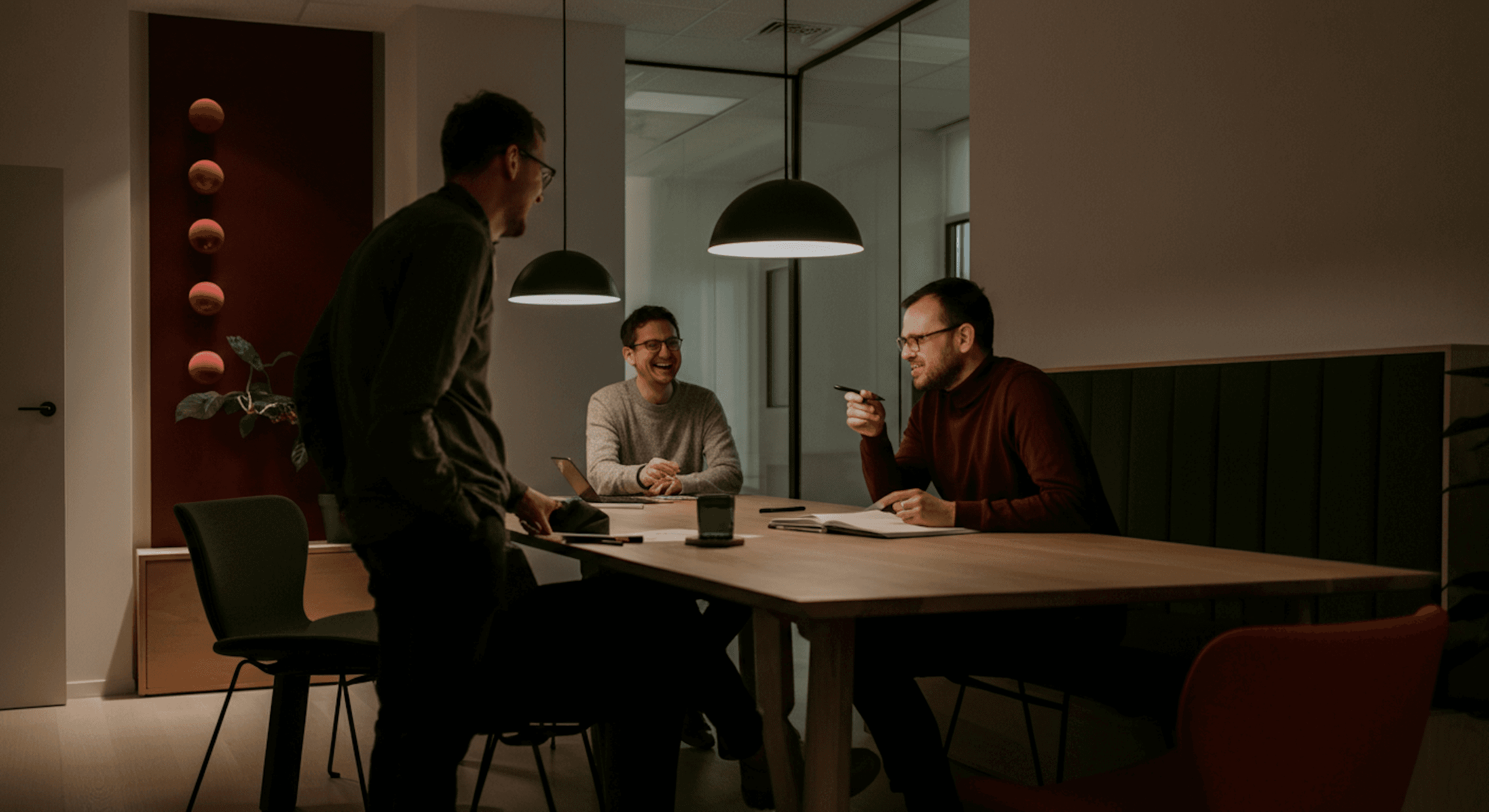 Three men in an office.
