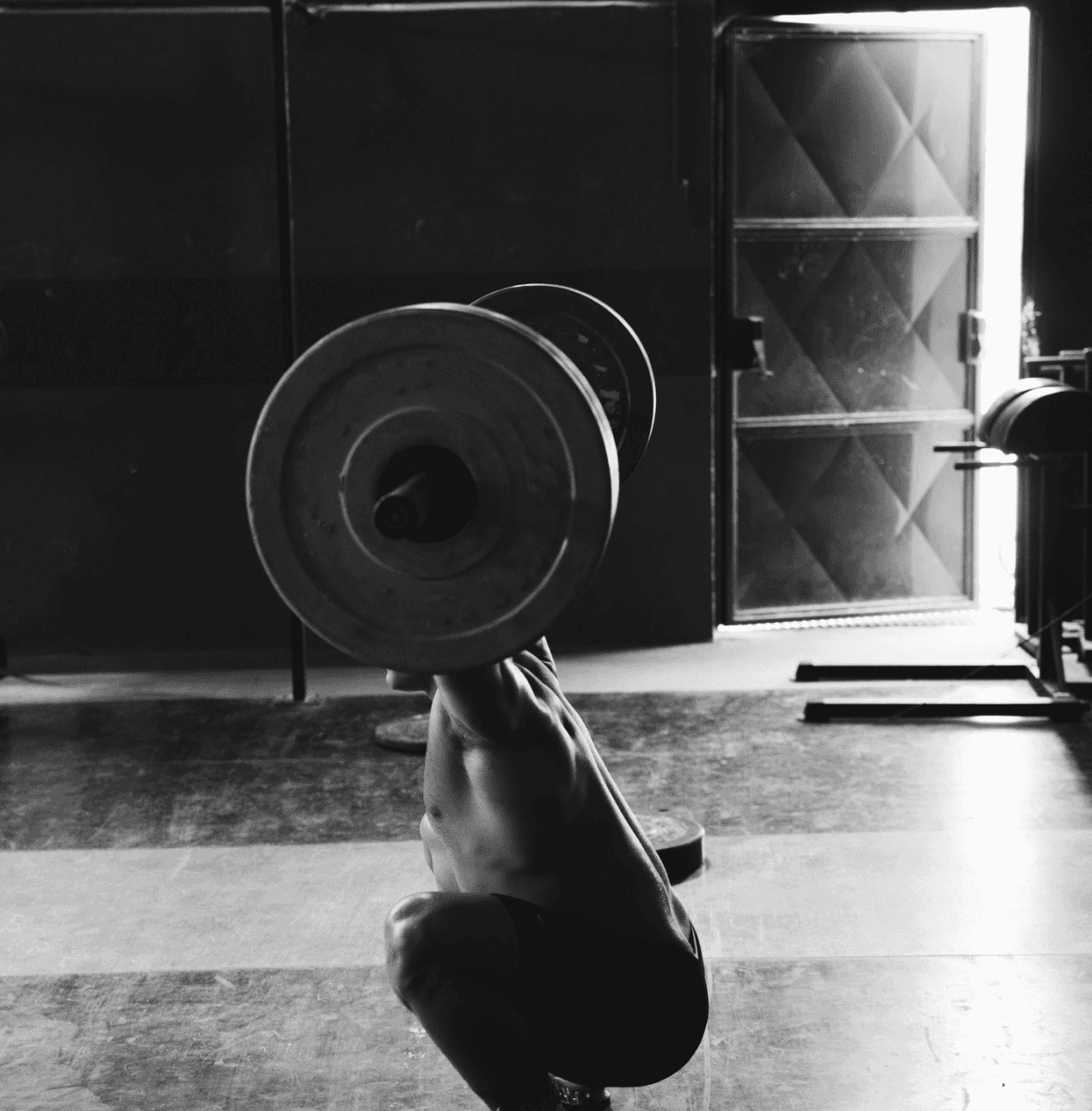 Fit man lifting weights