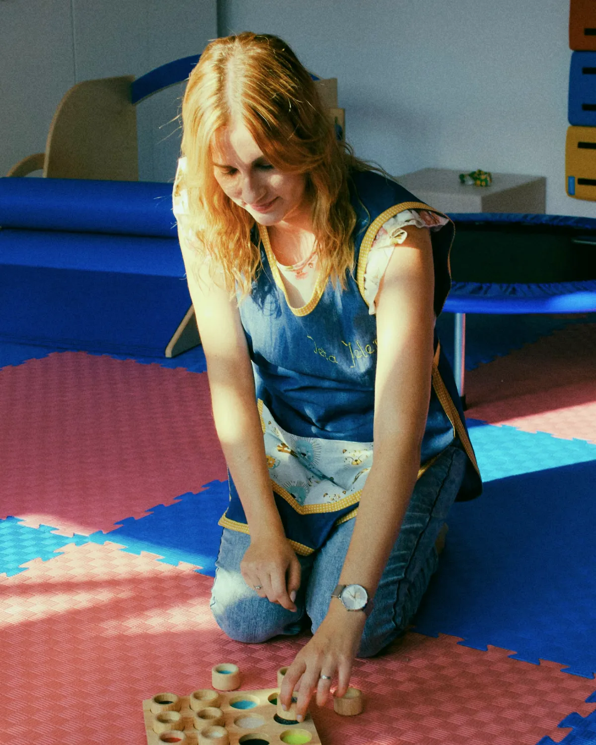 Village Physical Therapist getting ready for a session in the indoor playing area
