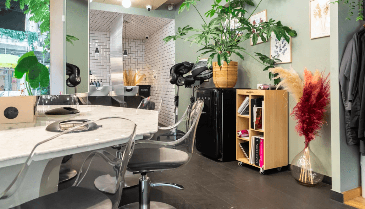 A person stands in a sandstone cave.