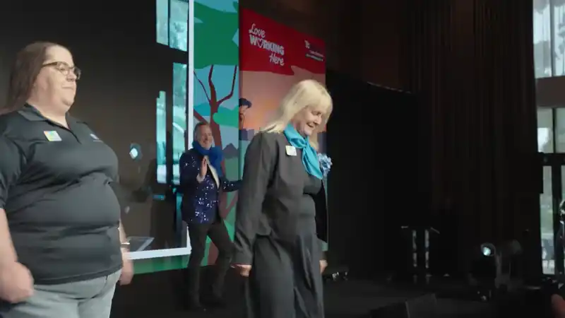 Care colleagues walking onto the stage during the Bupa Care event.